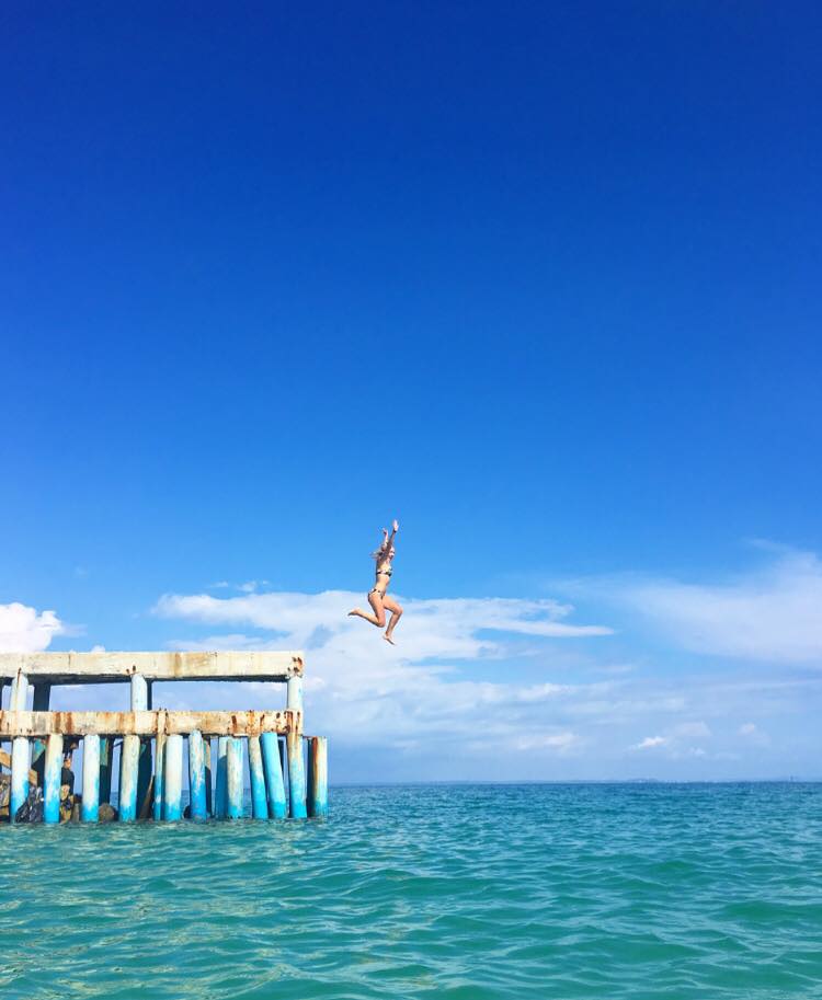 Jumping into the sea in Vietnam during teaching abroad experience