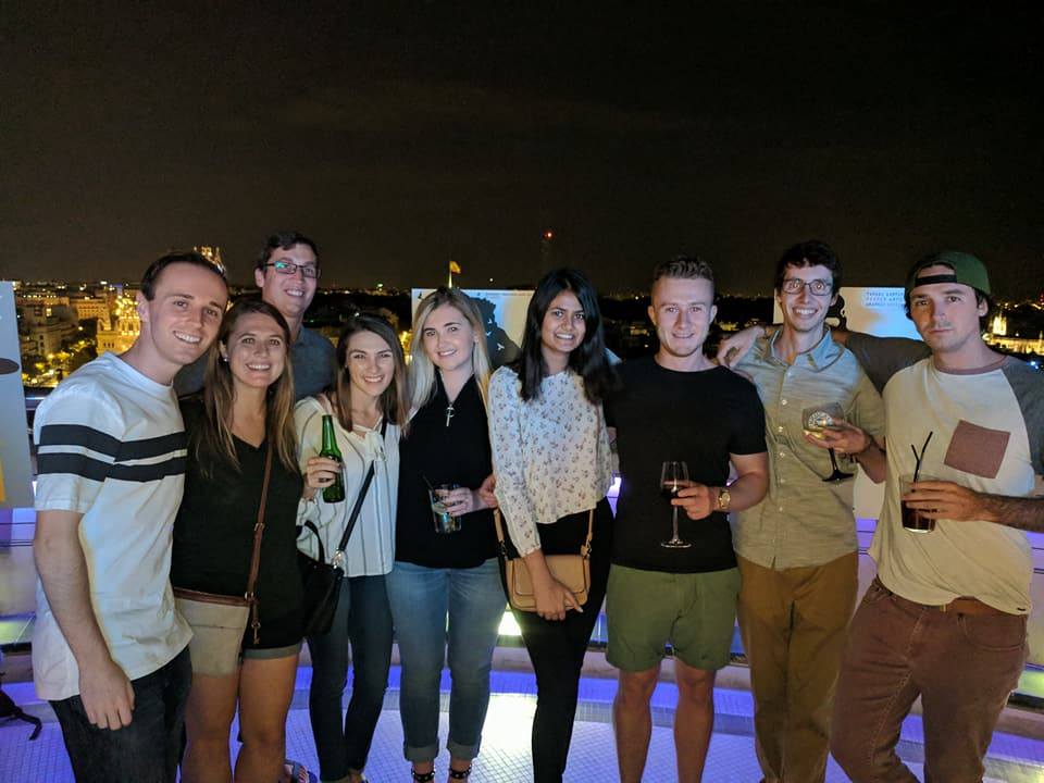 Group of friends enjoying a night out on a rooftop in Madrid