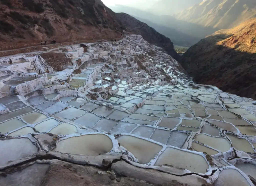 Two women overlooking Cusco city from scenic viewpoint in Peru