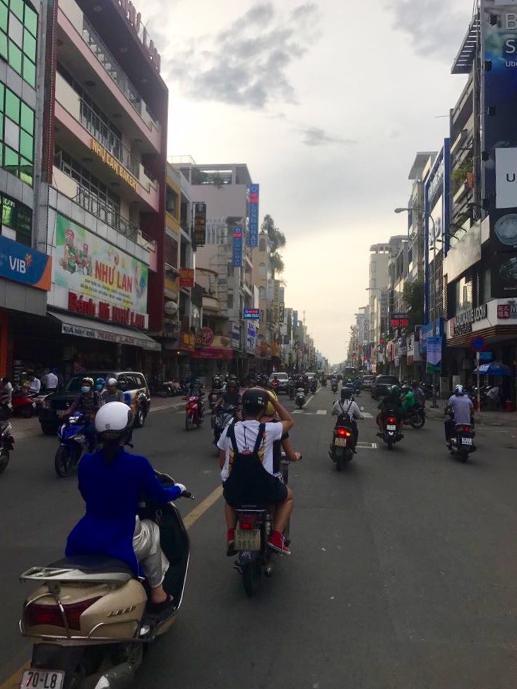 Busy street scene with motorbikes in Ho Chi Minh City Vietnam