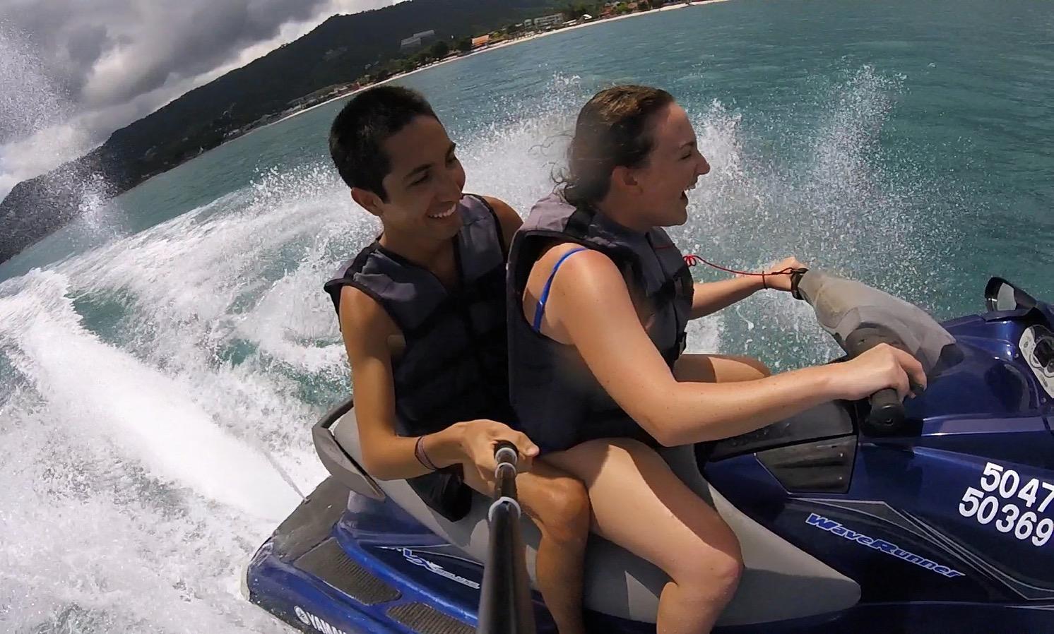 Two people riding a jet ski on the sea in Thailand