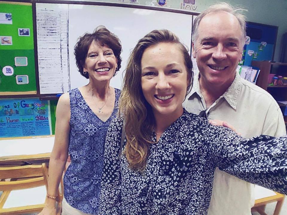 Teacher with colleagues in Thai classroom environment
