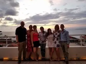 Group of TEFL teachers on rooftop terrace at sunset in Puerto Vallarta